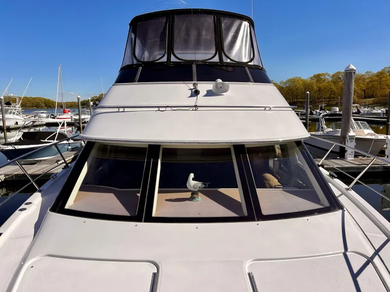 Slide: The Image of 2002 Carver 396 Motor Yacht docked at marina on a sunny day. - 7