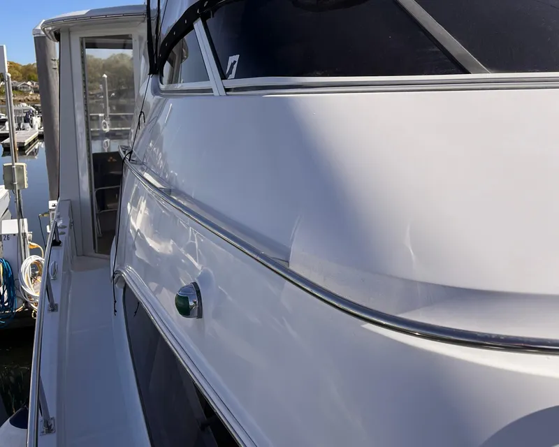 Slide: The Image of 2002 Carver 396 Motor Yacht side view at dock. - 8