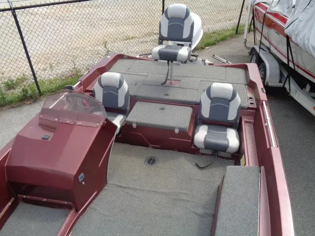 Slide: The Image of 1987 Venture Bass Boat 18 with seating and storage compartments. - 13