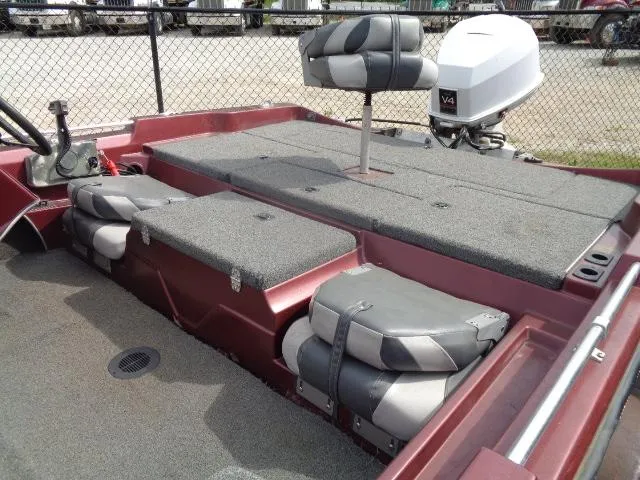 Slide: The Image of 1987 Venture Bass Boat 18 interior with seating and motor. - 3