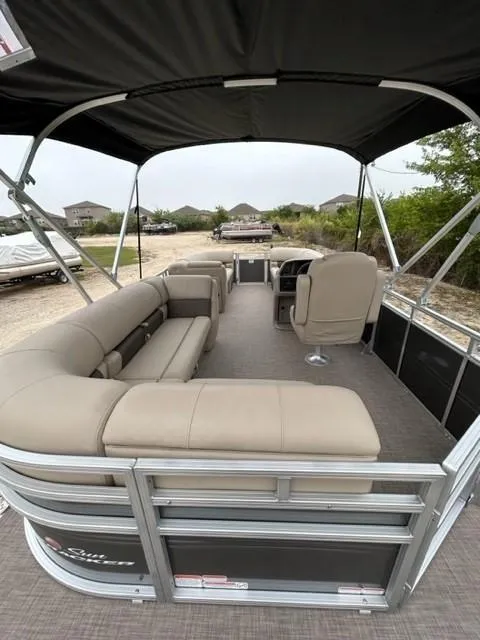 Slide: The Image of 2024 Sun Tracker Party Barge 20 DLX pontoon boat with spacious seating and canopy. - 6