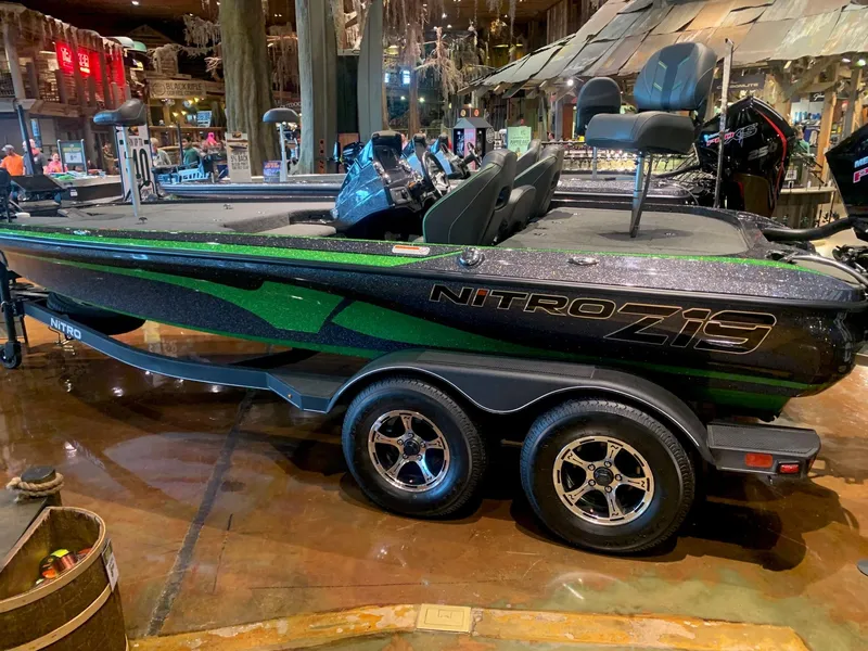 Slide: The Image of 2024 Nitro Z19 Pro boat with sleek design, displayed indoors on a trailer. - 1