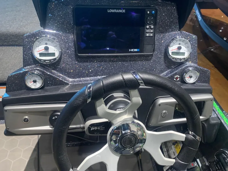 Slide: The Image of 2024 Nitro Z19 Pro dashboard with steering wheel and Lowrance HDS display. - 6