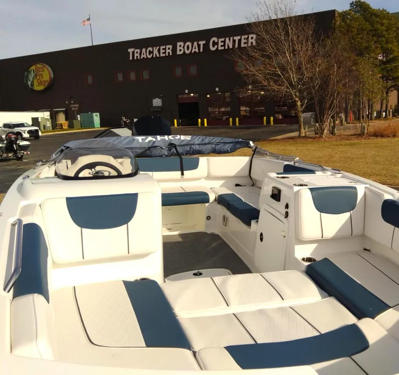 Slide: The Image of 2024 Tahoe 2150 boat at Tracker Boat Center, featuring spacious seating and modern design. - 2