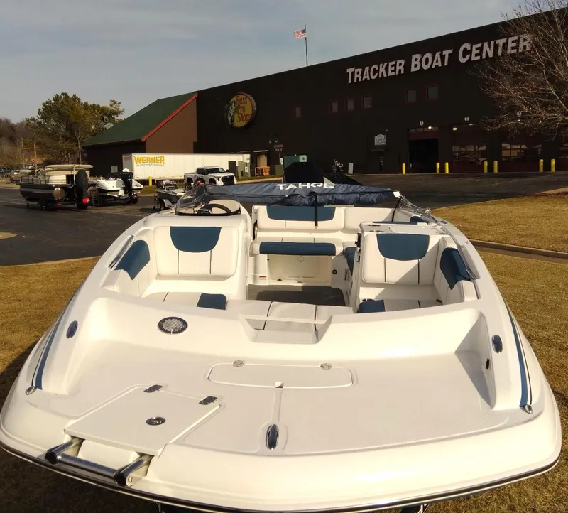 Slide: The Image of 2024 Tahoe 2150 boat at Tracker Boat Center, sunny day. - 3