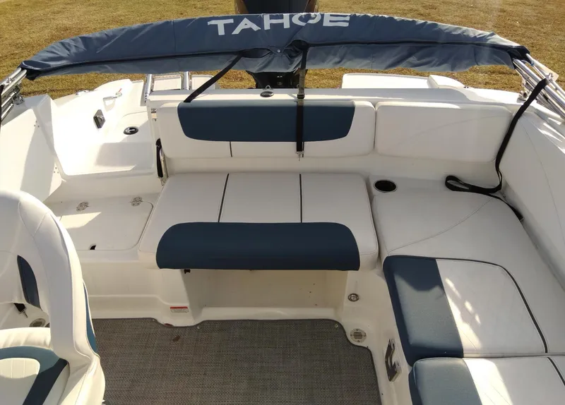 Slide: The Image of 2024 Tahoe 2150 boat interior with blue and white seating. - 4