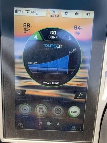Slide: The Image of 2021 Tigé ZX Class 25 ZX touchscreen display showing surf settings and wave tune options. - 12