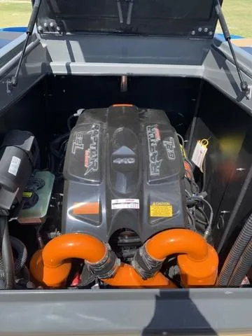Slide: The Image of 2021 Tigé ZX Class 25 ZX boat engine compartment with orange hoses. - 21