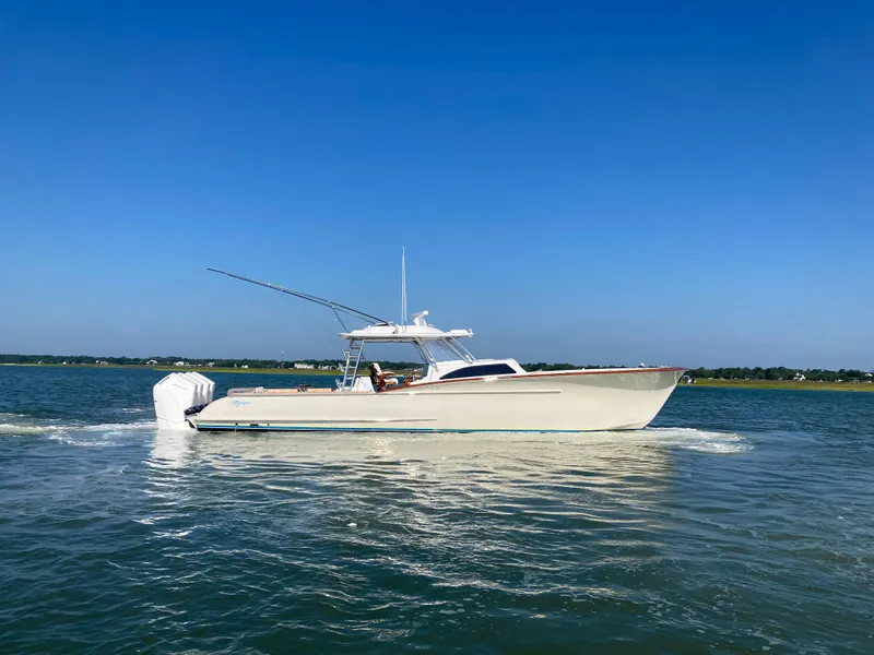 The Image of 2025 Mystique Boatworks M48 Custom Carolina cruising on a sunny day. - 0