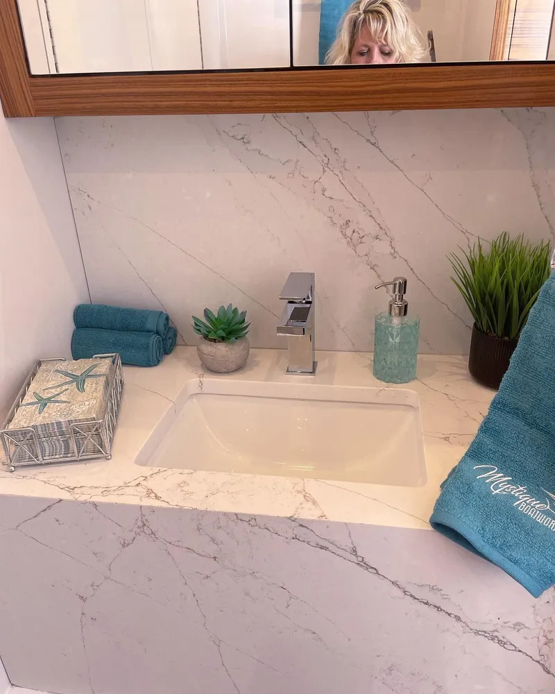 Slide: The Image of Luxurious bathroom sink on 2025 Custom Carolina Mystique Boatworks M48, featuring elegant decor. - 19