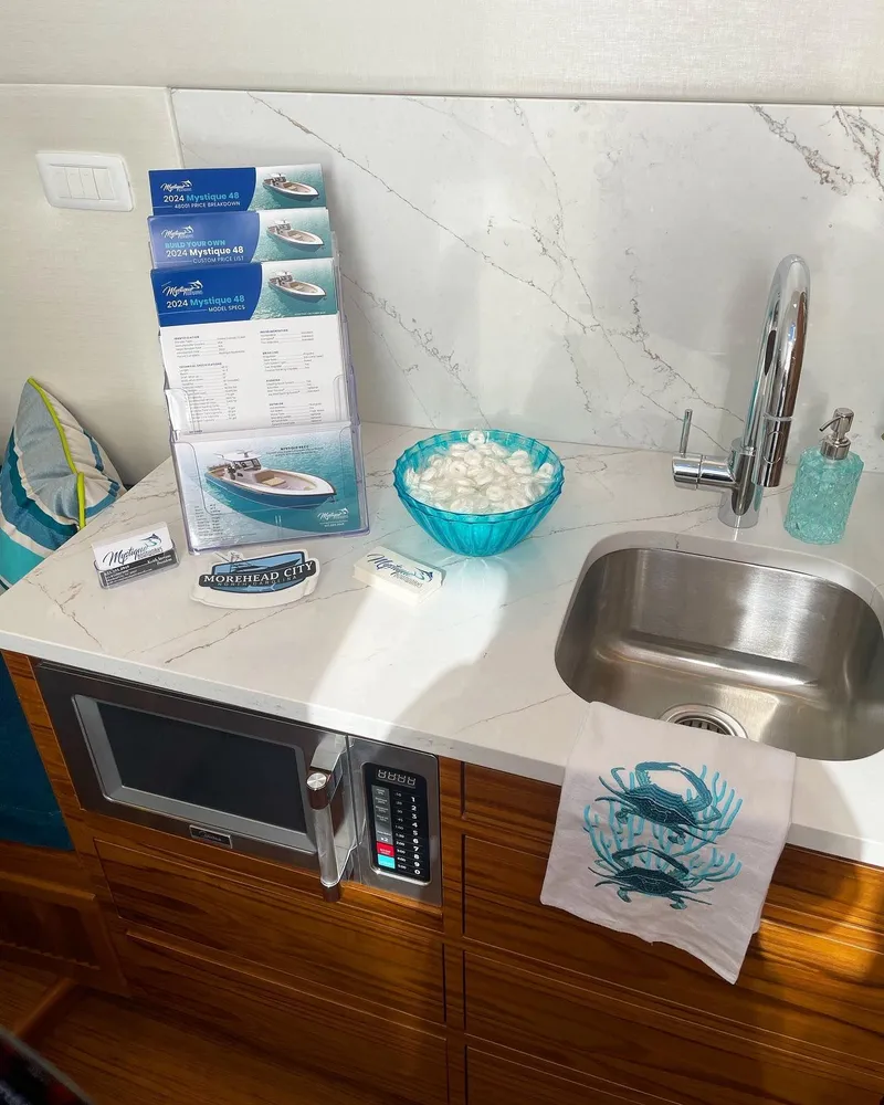 Slide: The Image of Modern kitchenette in 2025 Custom Carolina Mystique Boatworks M48 yacht. - 20