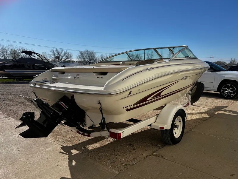 Slide: The Image of 2000 Sea Ray 185 Bow Rider boat on a trailer, rear view. - 2