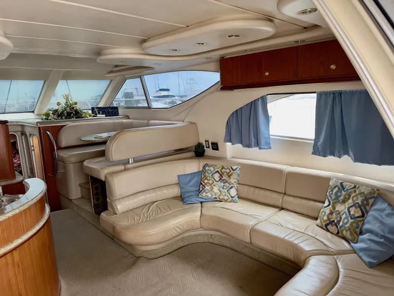 Slide: The Image of Luxurious interior of 1998 Maxum 4600 SCB yacht with plush seating and elegant decor. - 13
