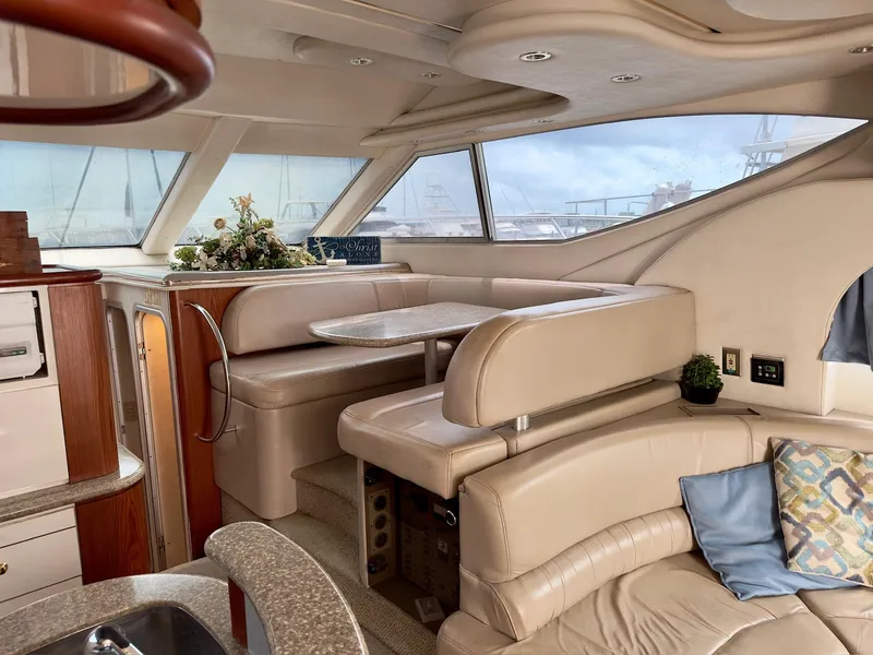 Slide: The Image of Luxurious interior of 1998 Maxum 4600 SCB yacht with plush seating and elegant decor. - 16