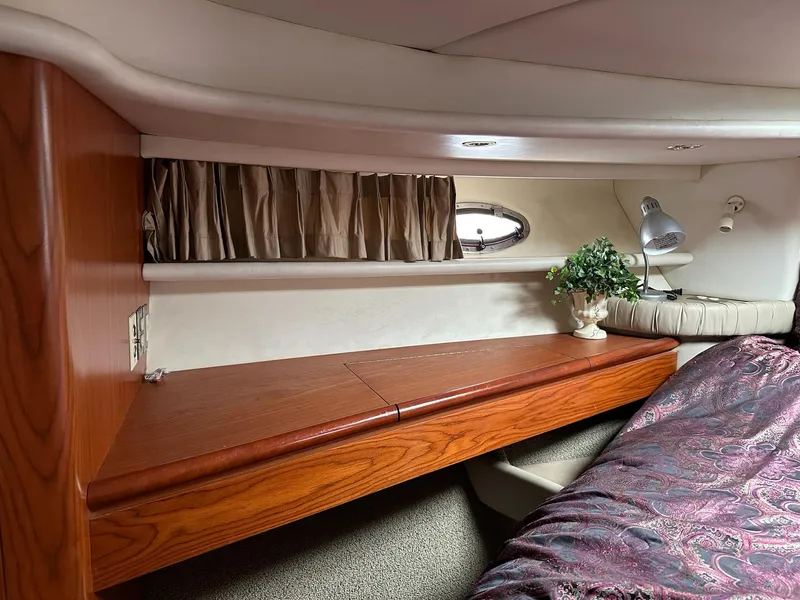 Slide: The Image of Interior of 1998 Maxum 4600 SCB yacht with wood finish and cozy decor. - 25