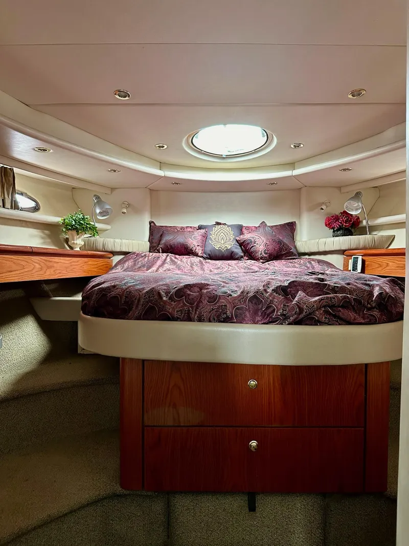 Slide: The Image of Luxurious bedroom interior of 1998 Maxum 4600 SCB yacht with elegant bedding and decor. - 26