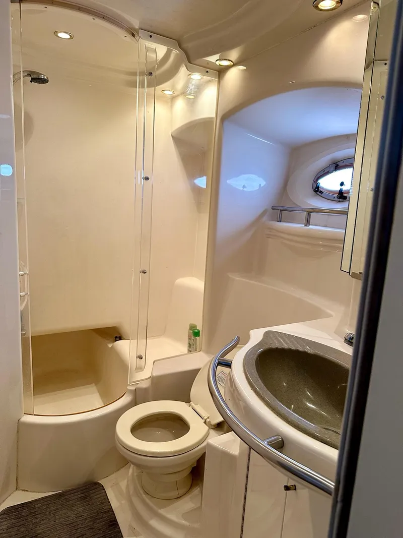 Slide: The Image of Bathroom interior of 1998 Maxum 4600 SCB yacht with shower and sink. - 27