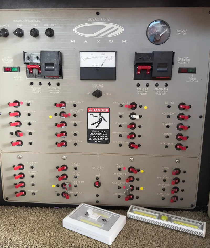 Slide: The Image of Control panel of a 1998 Maxum 4600 SCB boat with switches and warning labels. - 29