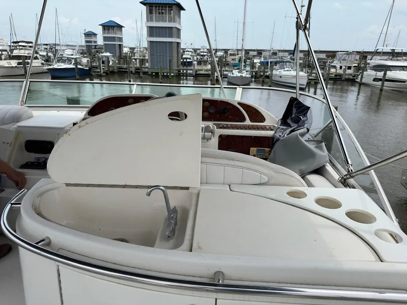 Slide: The Image of 1998 Maxum 4600 SCB yacht interior with sink and marina view. - 7
