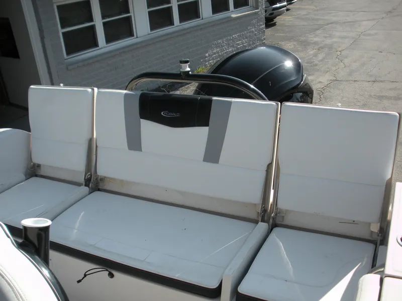 Slide: The Image of 2022 Robalo R230 Center Console boat seating area with white cushions. - 11