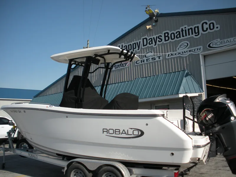 Slide: The Image of 2022 Robalo R230 Center Console boat at Happy Days Boating Co. dealership. - 2