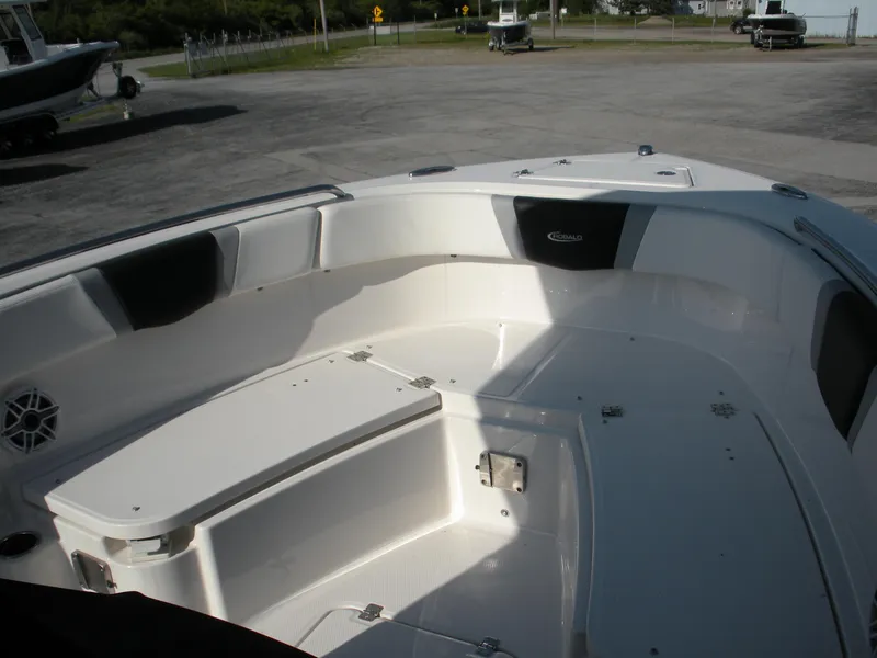 Slide: The Image of 2022 Robalo R230 Center Console boat interior with seating and storage. - 5