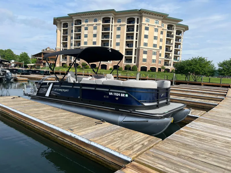 The Image of 2024 Starcraft SLS 3 Q DH pontoon boat docked at marina. - 0