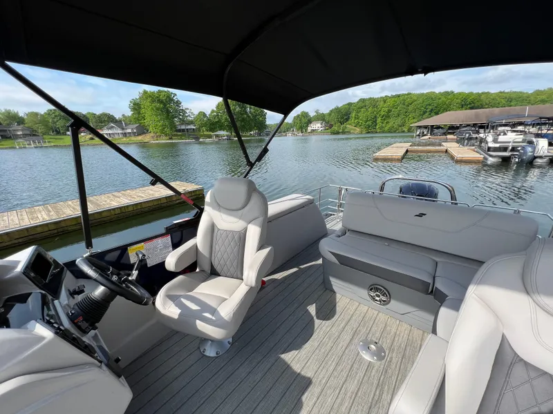 Slide: The Image of 2024 Starcraft SLS 3 Q DH pontoon boat interior with lake view. - 3