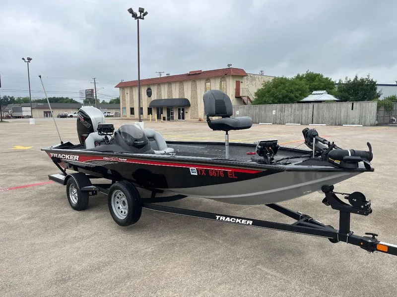 Slide: The Image of 2018 Tracker Pro Team 190 fishing boat on trailer in parking lot. - 10