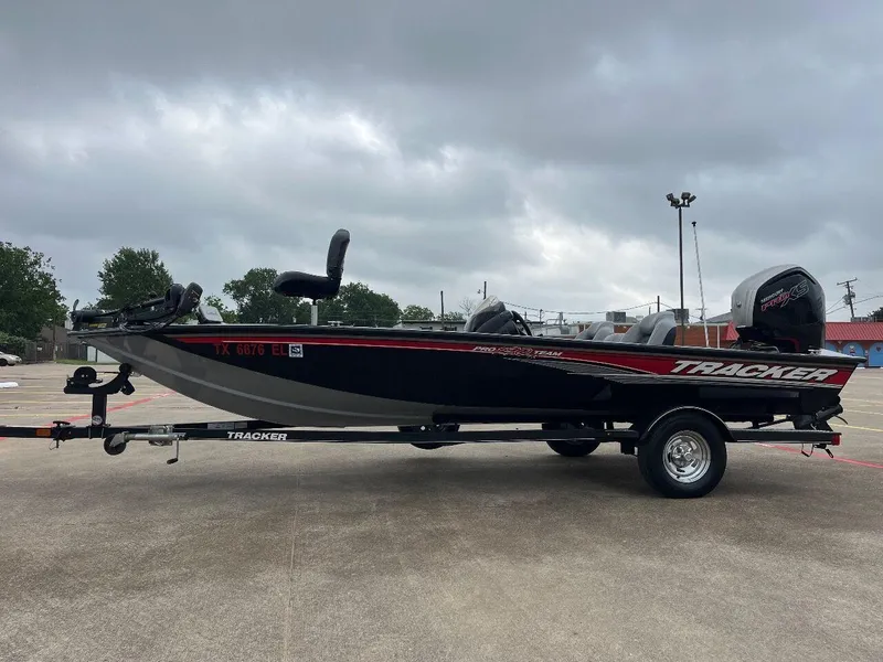 Slide: The Image of 2018 Tracker Pro Team 190 boat on trailer in parking lot. - 13