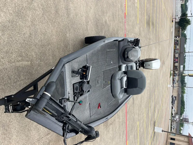 Slide: The Image of 2018 Tracker Pro Team 190 fishing boat in a parking lot. - 25