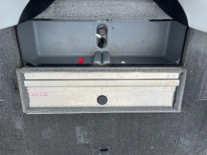 Slide: The Image of 2018 Tracker Pro Team 190 boat storage compartment with gray interior. - 44