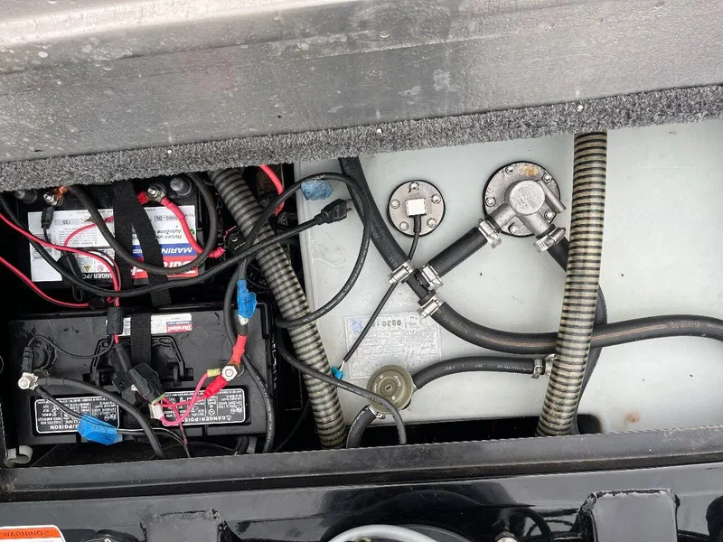 Slide: The Image of 2018 Tracker Pro Team 190 boat battery and wiring compartment. - 46