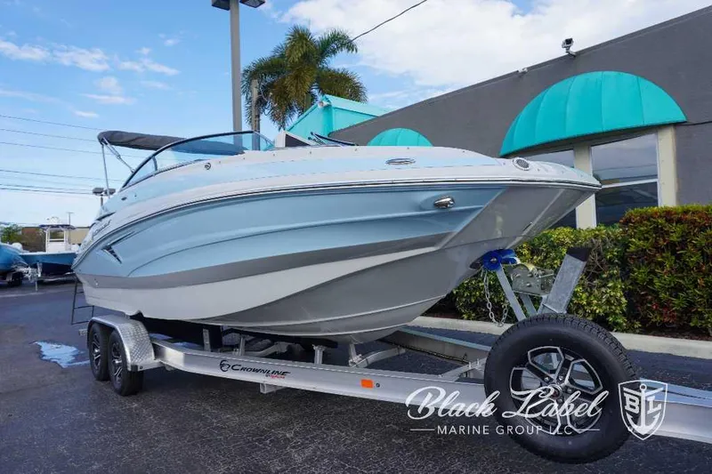 Slide: The Image of 2024 Crownline E240 XS boat on a trailer at Black Label Marine Group. - 10