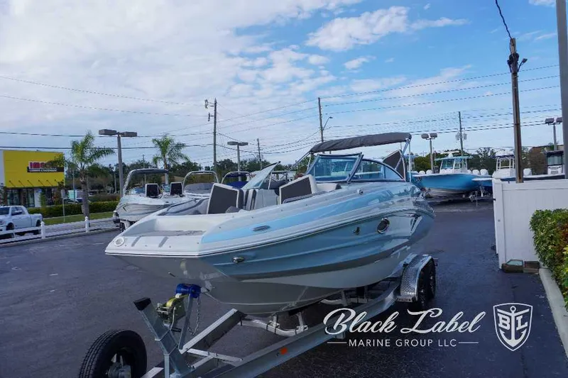 Slide: The Image of 2024 Crownline E240 XS boat on trailer at Black Label Marine Group. - 12