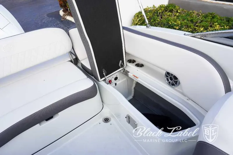 Slide: The Image of 2024 Crownline E240 XS boat interior storage compartment and seating. - 15