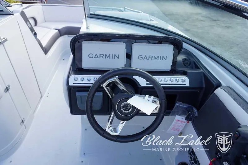 Slide: The Image of 2024 Crownline E240 XS boat dashboard with Garmin navigation system. - 21