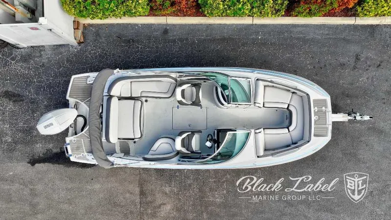 Slide: The Image of 2024 Crownline E240 XS boat, aerial view, Black Label Marine Group logo. - 3