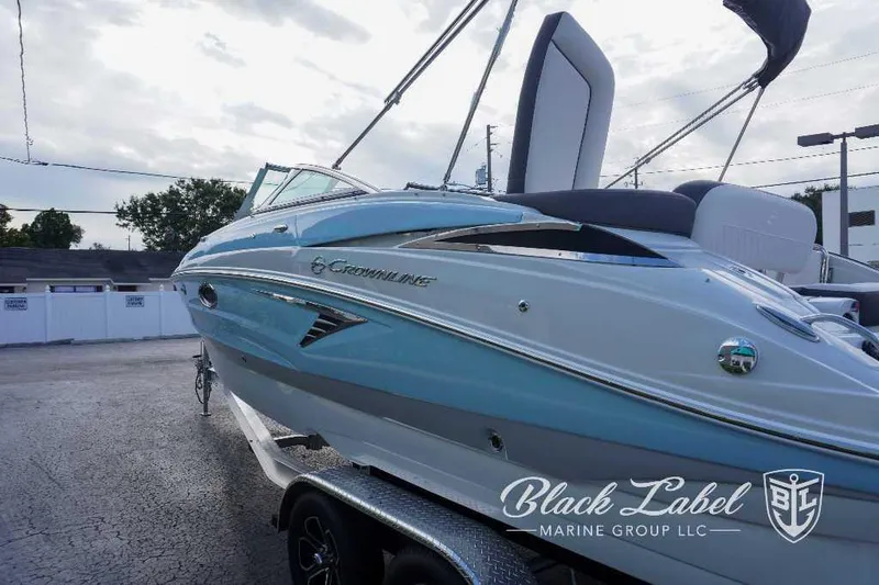 Slide: The Image of 2024 Crownline E240 XS boat displayed by Black Label Marine Group. - 7