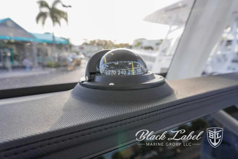 Slide: The Image of Compass on the dashboard of a 2024 Sea Fox 251 Bay boat by Black Label Marine Group. - 15
