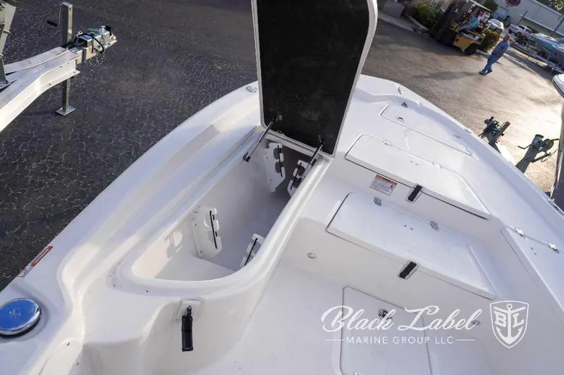 Slide: The Image of 2024 Sea Fox 251 Bay boat storage compartments and deck view. - 22