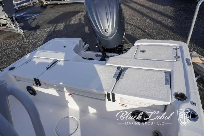 Slide: The Image of 2024 Sea Fox Seafox 251 Bay boat deck with storage compartments and motor. - 20