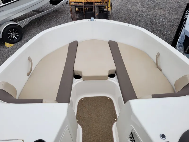 Slide: The Image of 2017 Bayliner Element E21 boat with beige and brown seating. - 10