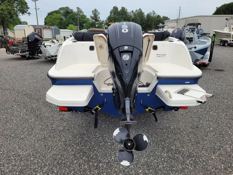 Slide: The Image of 2017 Bayliner Element E21 boat with outboard motor, rear view in a boatyard. - 6