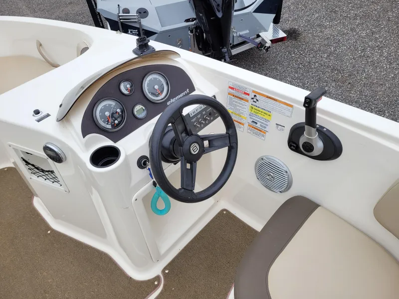 Slide: The Image of 2017 Bayliner Element E21 boat dashboard and steering wheel. - 9