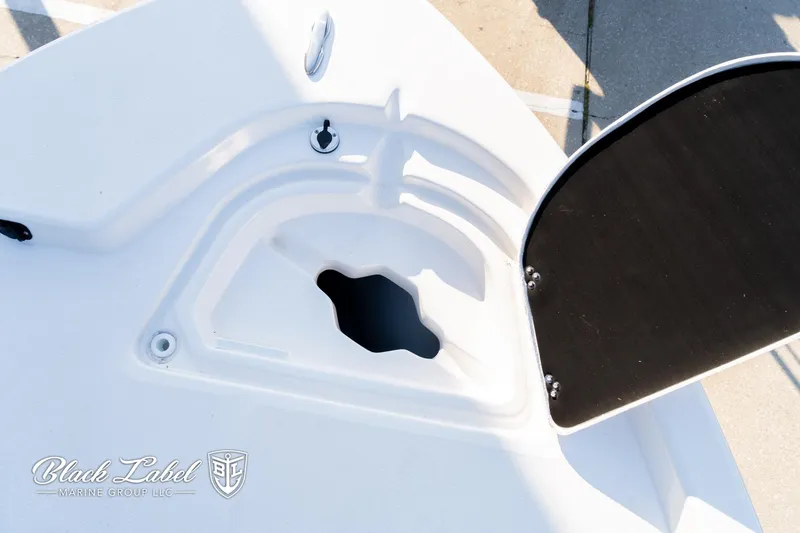 Slide: The Image of 2024 Sea Fox Seafox 251 Bay boat deck with storage compartment open. - 11