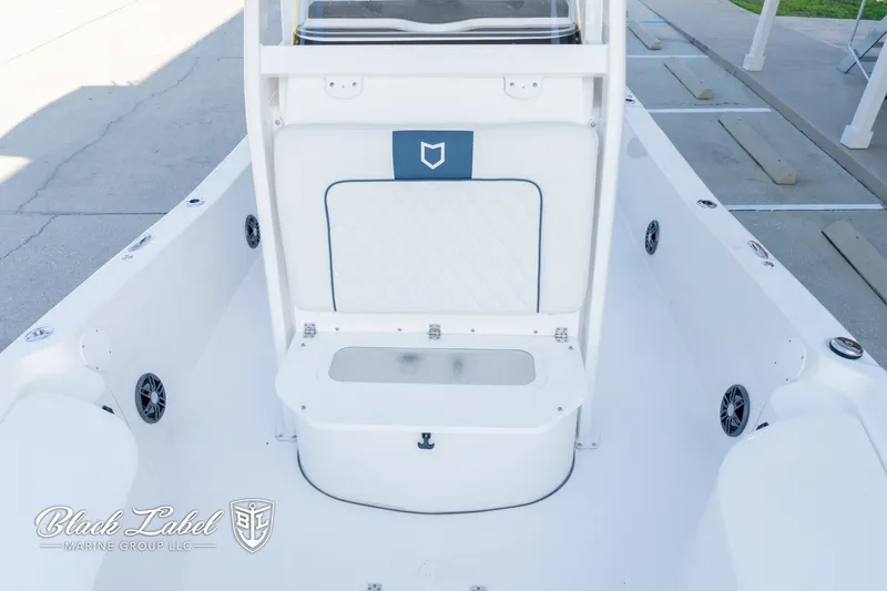 Slide: The Image of 2024 Sea Fox Seafox 251 Bay boat interior with seating and storage. - 12