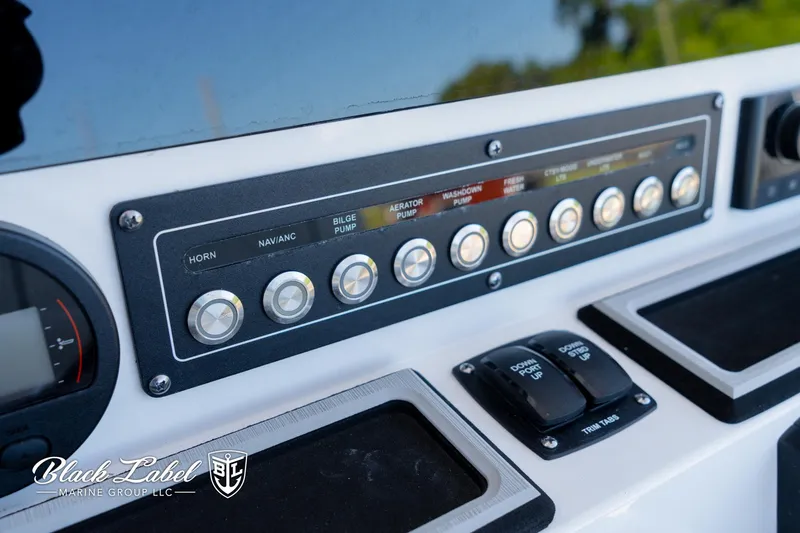 Slide: The Image of Control panel of 2024 Sea Fox Seafox 251 Bay boat with labeled switches. - 20