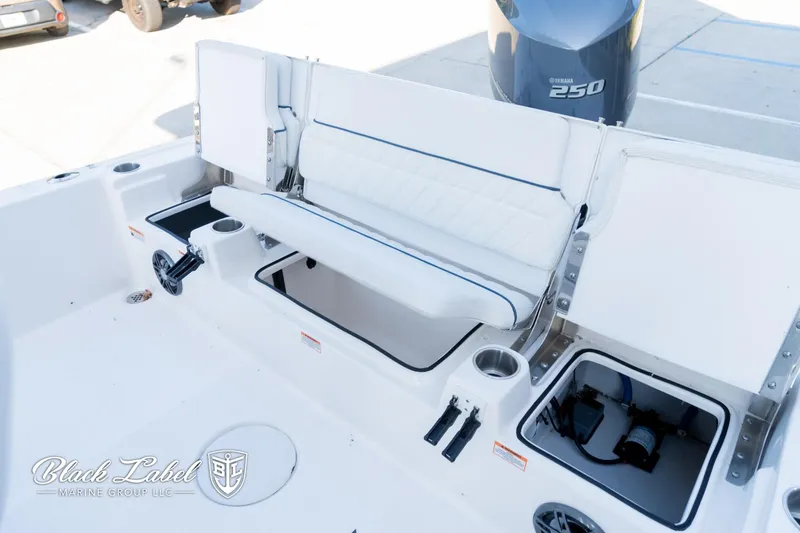 Slide: The Image of 2024 Sea Fox Seafox 251 Bay boat interior with seating and storage compartments. - 26