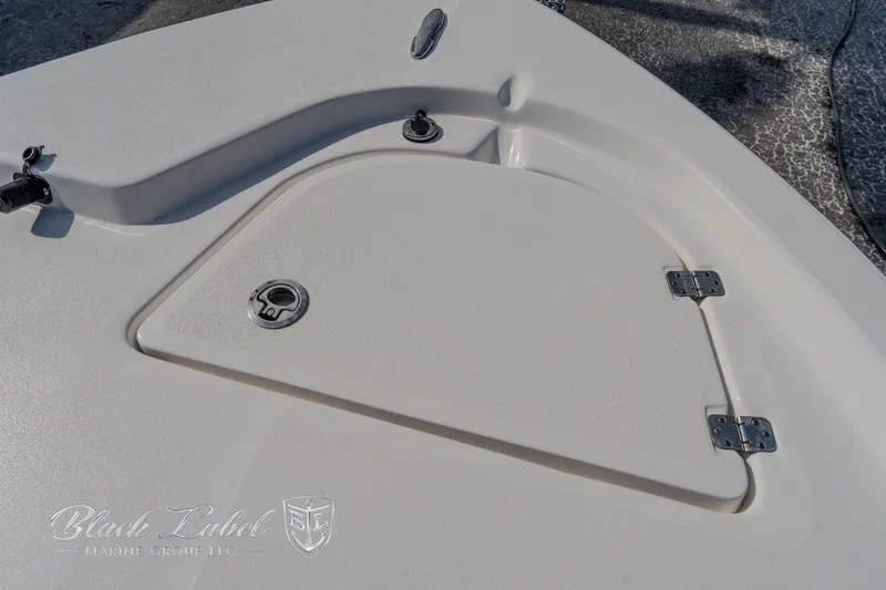 Slide: The Image of 2024 Sea Fox Seafox 251 Bay boat deck with storage compartment and hardware. - 11